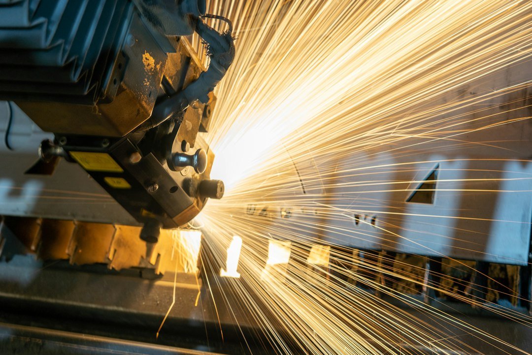 laser-cutting-machine-with-orange-sparks-hkjnx0edbje